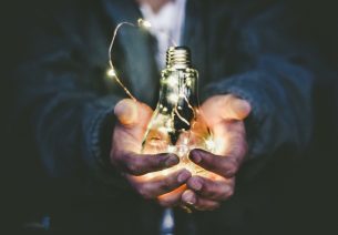 Man holding light bulb